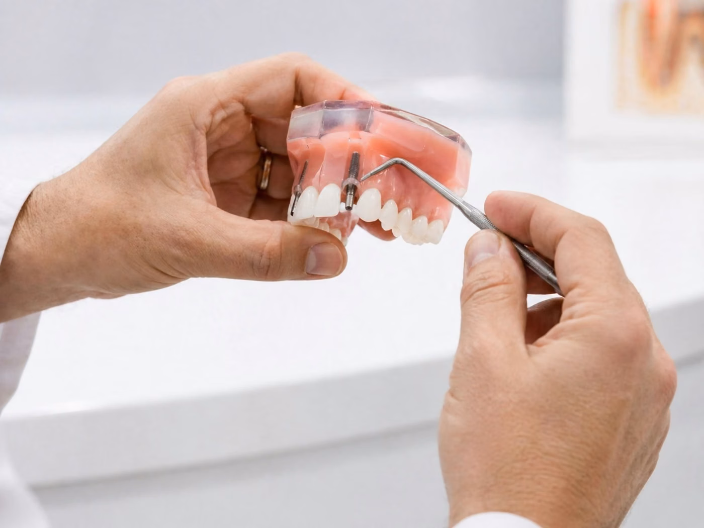 Dentist demonstrating restorations on a dental model